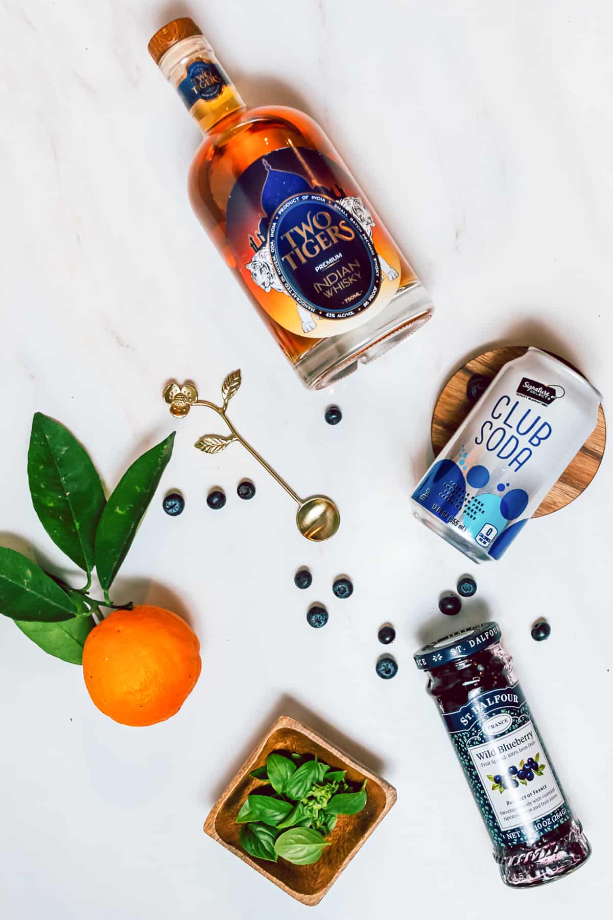 Club soda, orange juice, basil, blueberry jam, whiskey